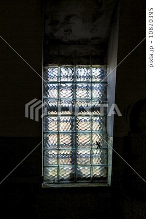 window with glass bricks in a dark room 10820395