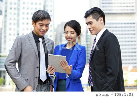 Three business office worker looking at tablet presentation Three business office worker looking at tablet presentation 10821503