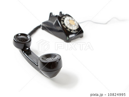 受話器の外れた黒電話器の写真素材