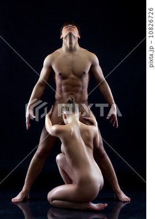 Passionate nude lovers on blue background 10826726