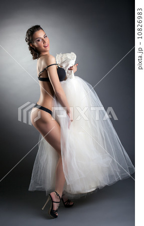 Sexy young model posing in black lingerie 10826983