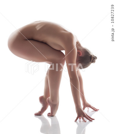 Emotional nude model posing in studio 10827239