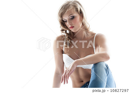 Portrait of pensive young girl posing in white bra Portrait of pensive young girl posing in white bra 10827297