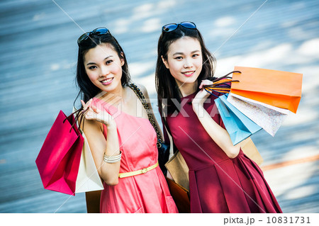 Young asian female shoppers Young asian female shoppers 10831731