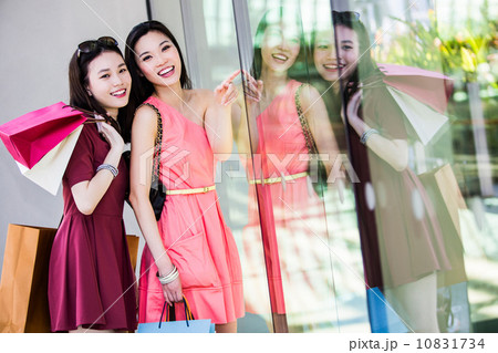 Young asian female shoppers Young asian female shoppers 10831734