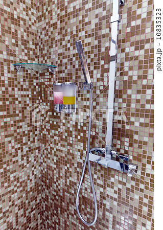 Modern designer tap and shower in bathroom 10835323