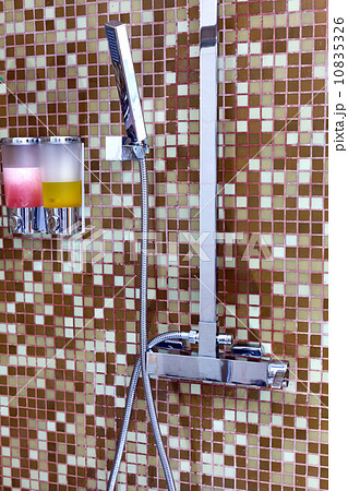 Modern designer tap and shower in bathroom 10835326