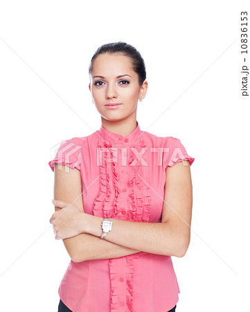 beautiful young businesswoman standing with hands folded against 10836153