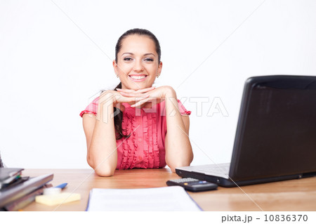 happy beautiful young business woman sitting at office desk happy beautiful young business woman sitting at office desk 10836370