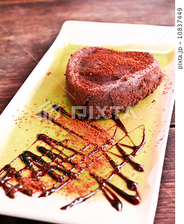 Heart shaped chocolate cake on plate. Heart shaped chocolate cake on plate. 10837449