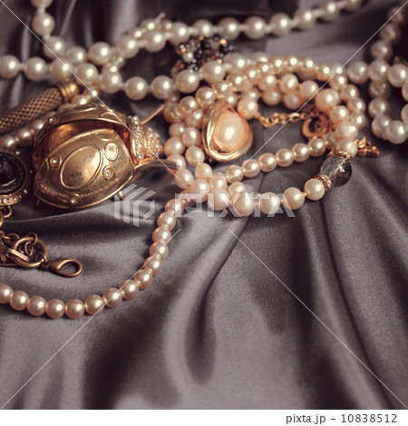 art vintage golden and pearl bijouterie with scarab on gray sil art vintage golden and pearl bijouterie with scarab on gray sil 10838512