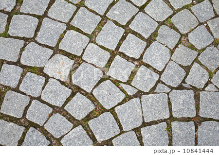 Gray granite cobblestone pavement. Closeup background texture Gray granite cobblestone pavement. Closeup background texture 10841444