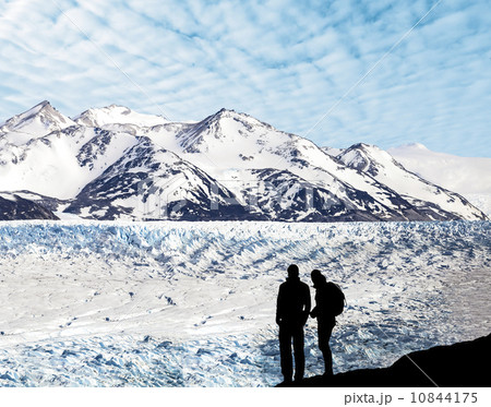 Silhouette of a couple admiring beautiful view of glacier. 10844175