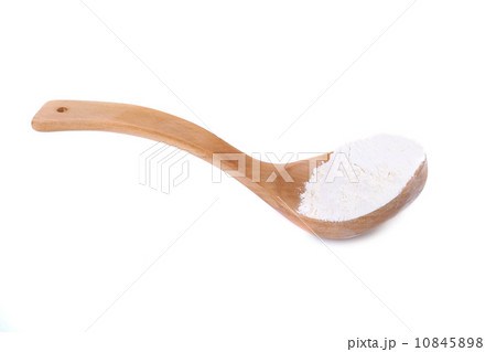 Wooden spoon with flour. Wooden spoon with flour. 10845898