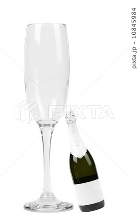 Big glass and little bottle of champagne. Big glass and little bottle of champagne. 10845984