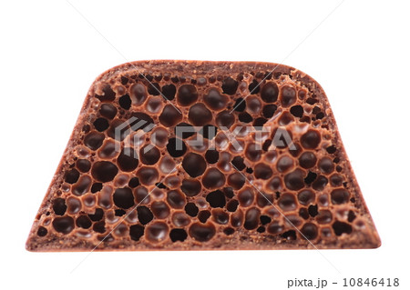 Cut of porous milk chocolate. Cut of porous milk chocolate. 10846418