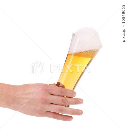 Full beer glass in hand 10849655