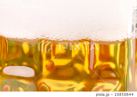 Closeup of mug with beer foam. Closeup of mug with beer foam. 10850644