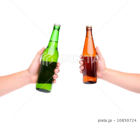 Two beer bottles and hands 10850724