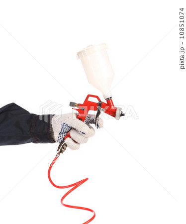 Hand holds spray gun. Hand holds spray gun. 10851074