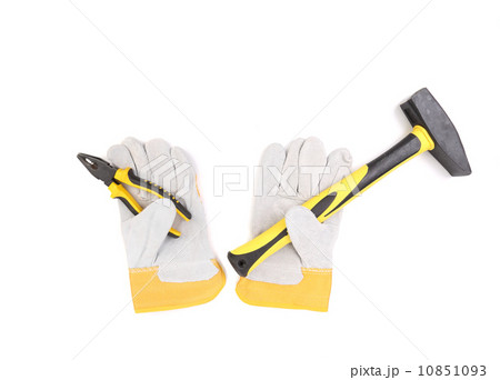 Gloves holding hammer and pliers. Gloves holding hammer and pliers. 10851093