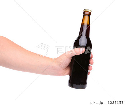 Beer bottle in the hand isolated on white Beer bottle in the hand isolated on white 10851534