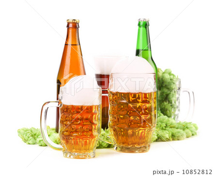 Two mugs of beer with foam and bottels 10852812