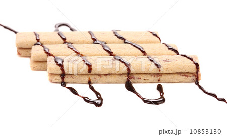 Stream chocolate on stics of biscuit. 10853130