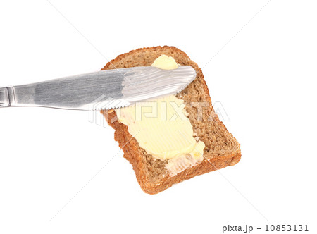 Smear butter on bread the knife. Smear butter on bread the knife. 10853131