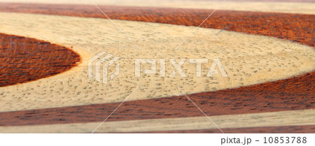 Beige and brown circles on wood. 10853788