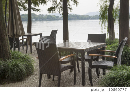Tables and chairs at the lake Tables and chairs at the lake 10860777