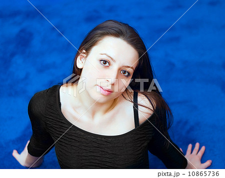 portrait of a young girl on blue background 10865736