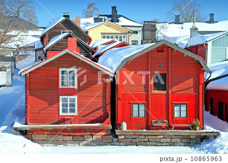 Red wooden houses on the river coast in Porvoo town, Finland (winter season) 10865963