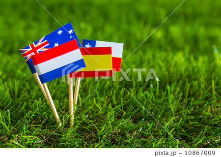 Paper cut of flags on grass for Soccer championship 2014 , group 10867009