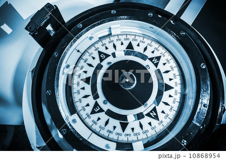 Naval compass. Blue toned monochrome close-up photo 10868954