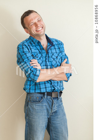 Young laughing Caucasian man in casual shirt, studio portrait Young laughing Caucasian man in casual shirt, studio portrait 10868956