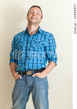 Studio portrait of young positive Caucasian man in casual shirt Studio portrait of young positive Caucasian man in casual shirt 10868957
