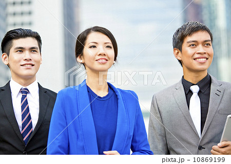 Three business executives looking ahead smiling close up Three business executives looking ahead smiling close up 10869199