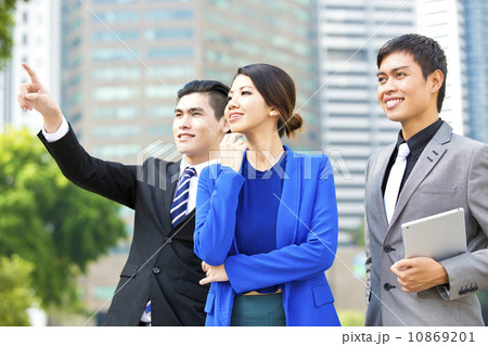 Three business executives looking at future smiling Three business executives looking at future smiling 10869201