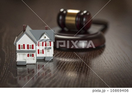 Gavel and Small Model House on Table Gavel and Small Model House on Table 10869406