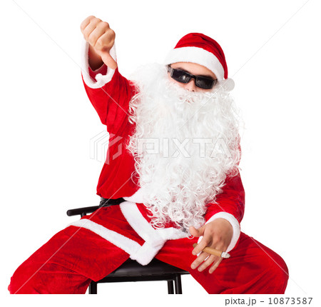 Santa Claus sitting on a chair wearing sunglasses showing thumbs 10873587