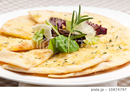 garlic pita bread pizza with salad on top garlic pita bread pizza with salad on top 10874797