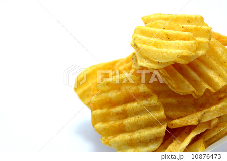 Delicious potato chips in bowl on a white background Delicious potato chips in bowl on a white background 10876473
