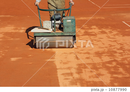 Rolling a tennis court Rolling a tennis court 10877990