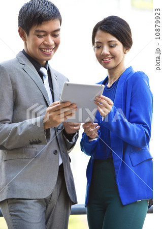 Business office staff looking at tablet Business office staff looking at tablet 10879923