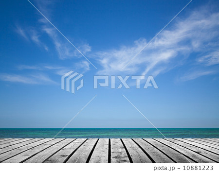 Empty gray wooden pier with sea and cloudy sky on background 10881223