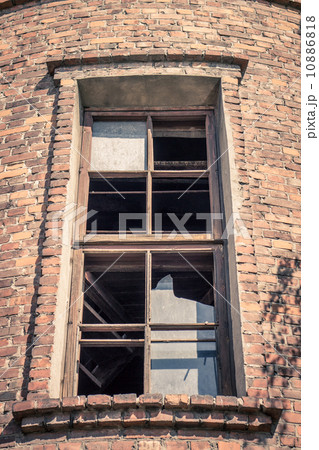 High window in old brick building 10886818