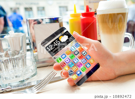 Smartphone with transparent screen in human hands. Smartphone with transparent screen in human hands. 10892472