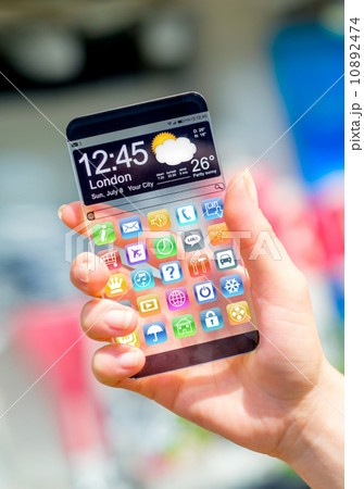 Smartphone with transparent screen in human hands. Smartphone with transparent screen in human hands. 10892474