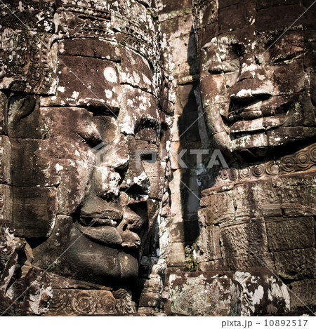 Huge carved Buddha faces of Bayon. Angkor Wat complex, Siem Reap, Cambodia Huge carved Buddha faces of Bayon. Angkor Wat complex, Siem Reap, Cambodia 10892517
